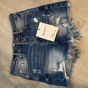 Distressed denim shorts